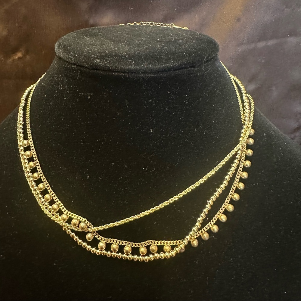 The sis kiss gold tone triple layered signed necklace with original box